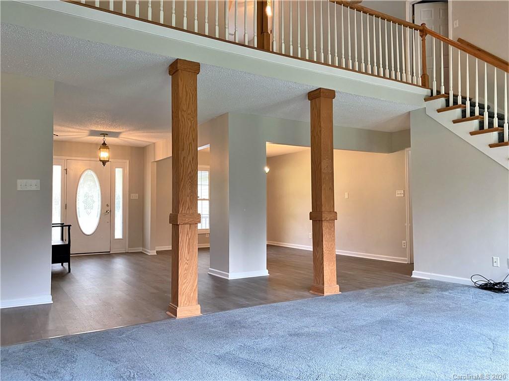 2641 Cameron Road Chester, SC 29706 - Photo 19 of 46 a view of a hallway with wooden floor and staircase