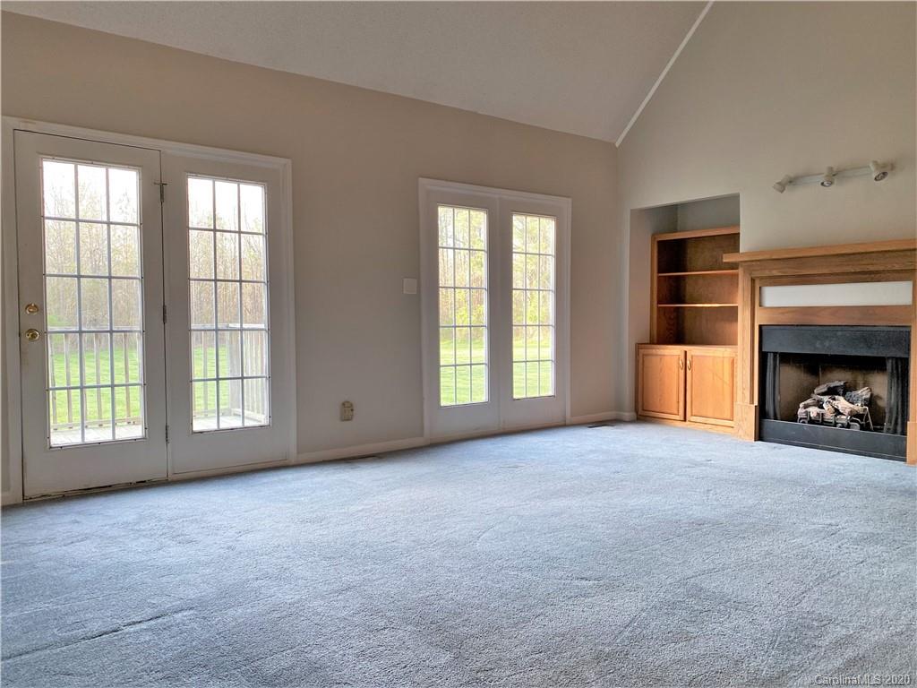 2641 Cameron Road Chester, SC 29706 - Photo 21 of 46 a view of an empty room with a fireplace and a window