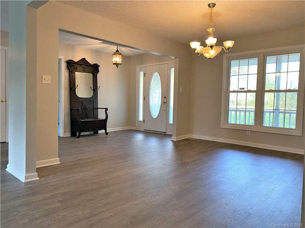2641 Cameron Road Chester, SC 29706 - Photo 23 of 46 a view of a livingroom with wooden floor and staircase