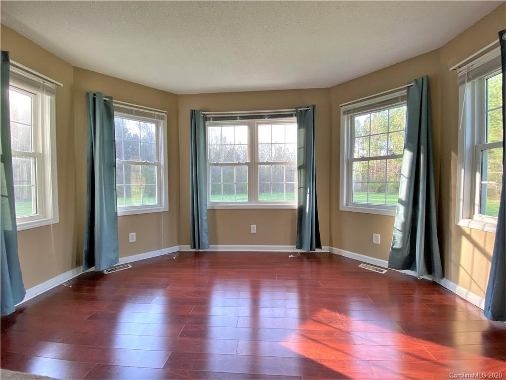 2641 Cameron Road Chester, SC 29706 - Photo 32 of 46 a view of an empty room with wooden floor and a window