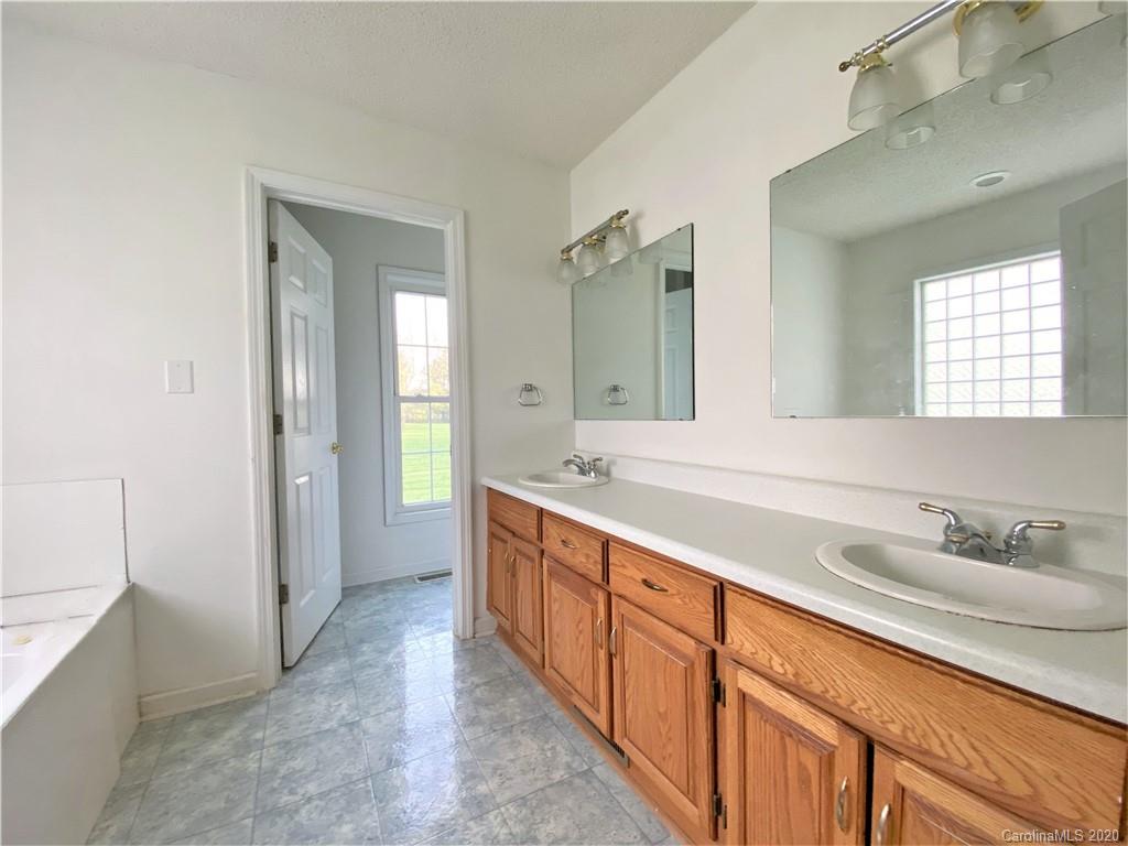 2641 Cameron Road Chester, SC 29706 - Photo 34 of 46 a spacious bathroom with double vanity and a mirror
