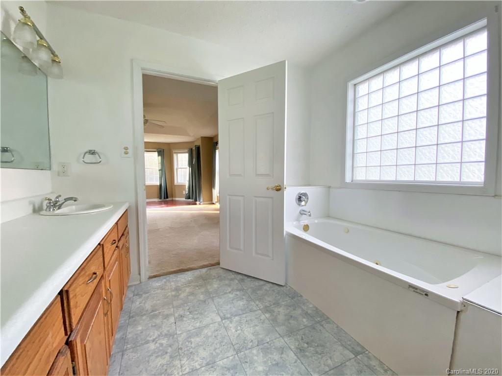 2641 Cameron Road Chester, SC 29706 - Photo 35 of 46 a bathroom with a tub sink and mirror