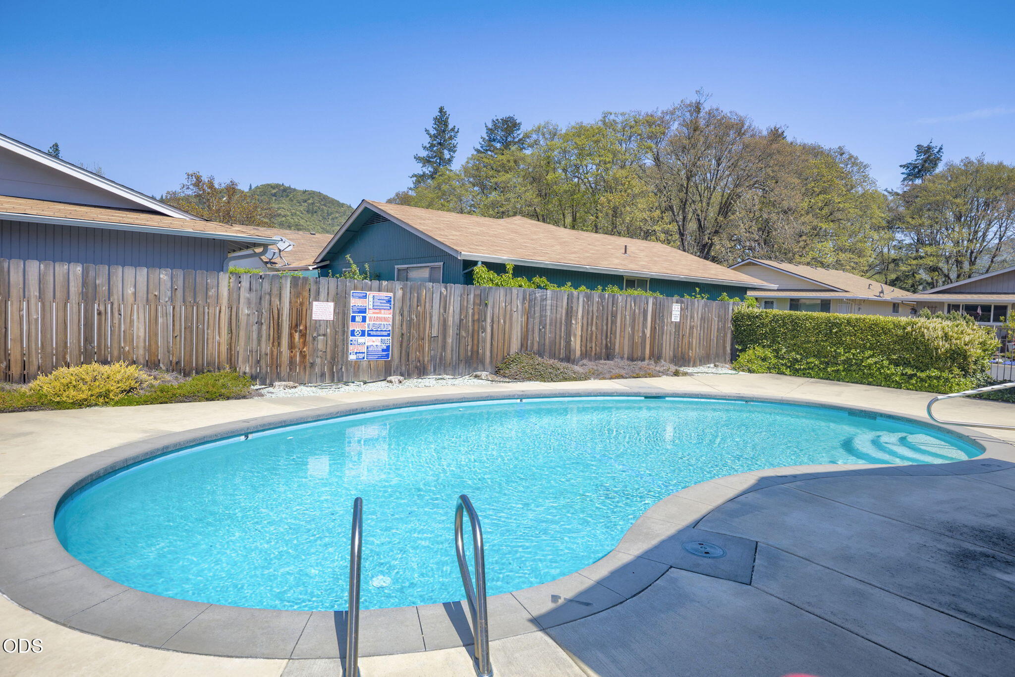 103 Brookside Court Rogue River, OR 97537 - Photo 22 of 27 a view of a backyard with a small swimming pool