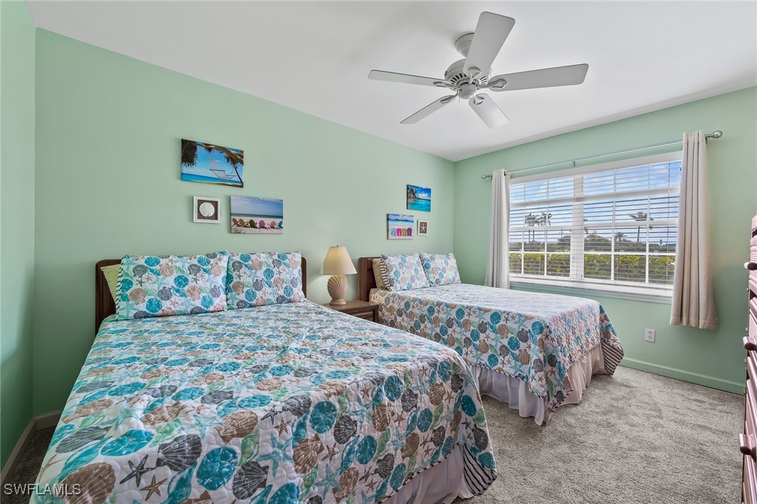 14995 Rivers Edge Court, Unit 151 Fort Myers, FL 33908 - Photo 11 of 18 a bedroom with double bed and a window