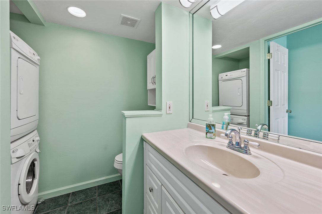 14995 Rivers Edge Court, Unit 151 Fort Myers, FL 33908 - Photo 12 of 18 a bathroom with a sink and a mirror
