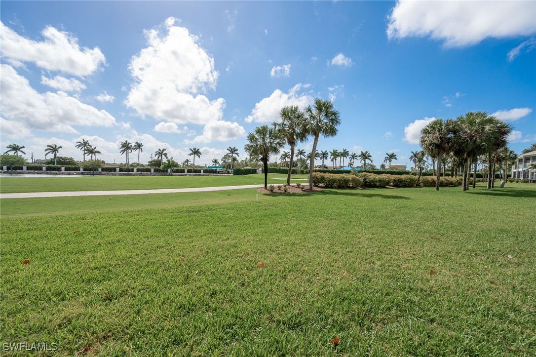 14995 Rivers Edge Court, Unit 151 Fort Myers, FL 33908 - Photo 15 of 18 a view of a golf course with a lake