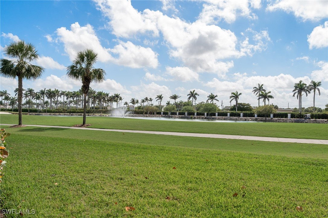 14995 Rivers Edge Court, Unit 151 Fort Myers, FL 33908 - Photo 16 of 18 a view of a golf course with a lake