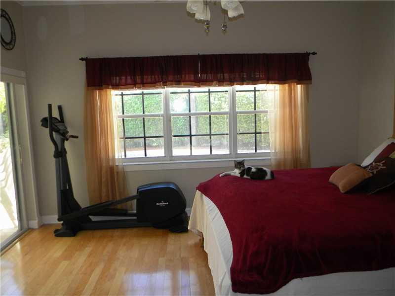 Undisclosed Address Weston, FL 33331 - Photo 11 of 23 a bedroom with a bed and a window