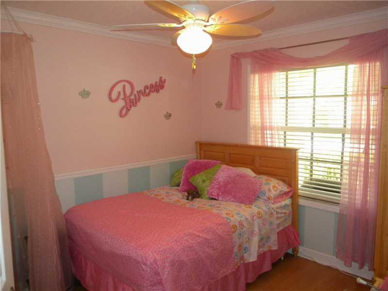 Undisclosed Address Weston, FL 33331 - Photo 15 of 23 a bedroom with a bed and a window