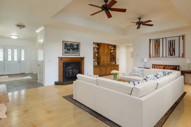 a living room with furniture and a fireplace