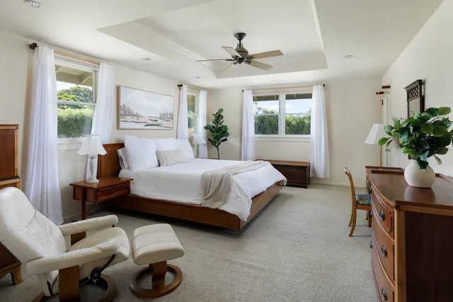 a bedroom with furniture and a window