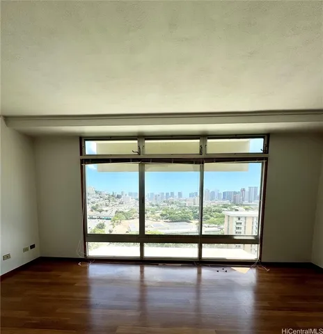 a view of an entryway with wooden floor