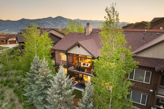 1737 East Viewside Circle Hideout, UT 84036 - Photo 1 of 35 Multi-level residence featuring a prominent balcony, lower patio, and multiple windows