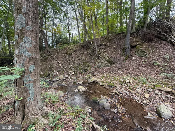 a view of a house with a yard porch and sitting area