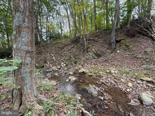 a view of a house with a yard porch and sitting area