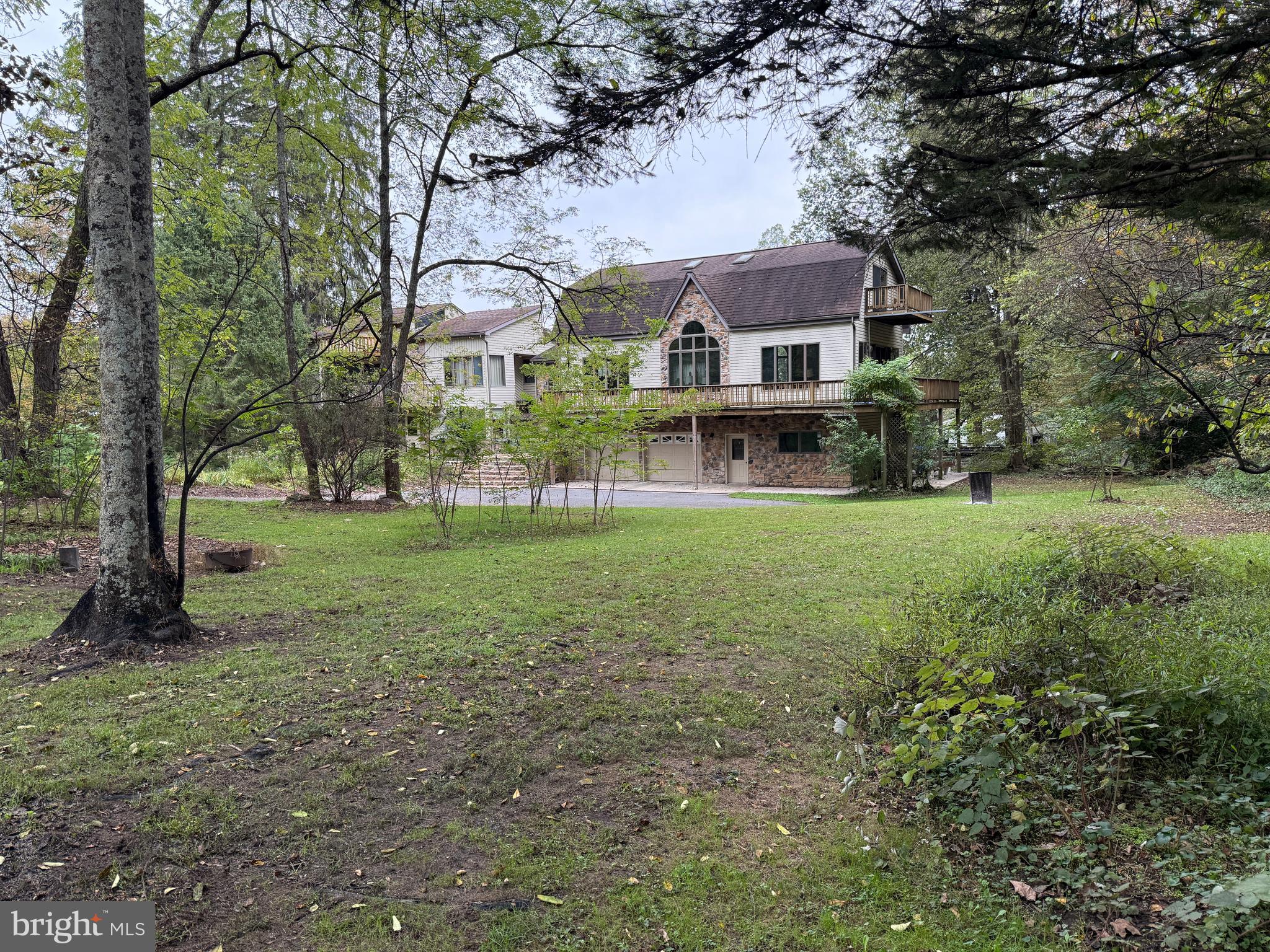 9969 Circle Drive St. Thomas, PA 17252 - Photo 2 of 81 a front view of a house with garden