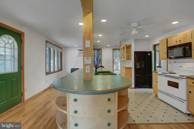 a view of an entryway with wooden floor