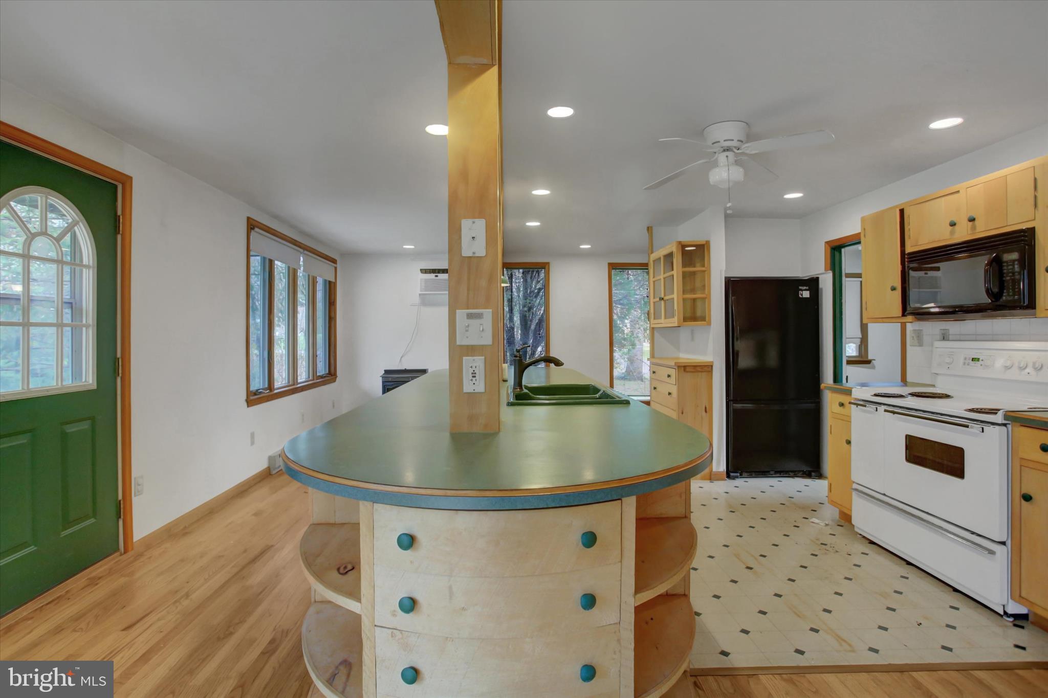 9969 Circle Drive St. Thomas, PA 17252 - Photo 39 of 81 a kitchen with stainless steel appliances granite countertop a sink a stove and a refrigerator