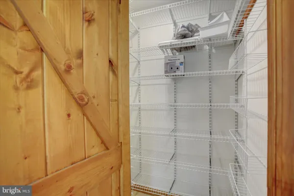 a view of a livingroom with furniture and staircase