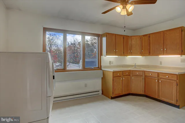a view of entryway with a window and wooden floor