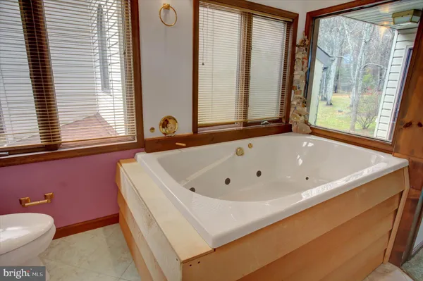 a picture of a bathroom with a shower