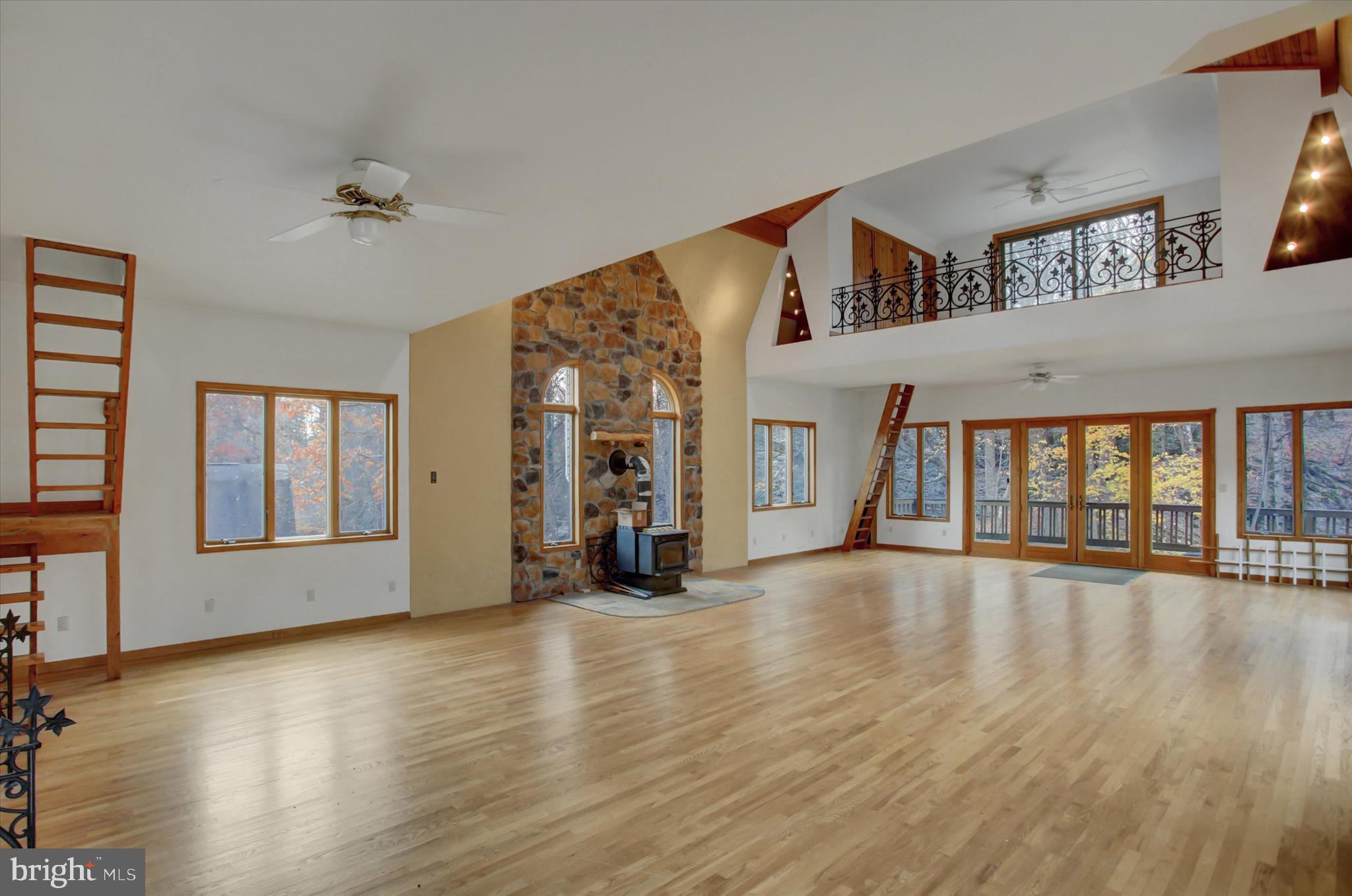 9969 Circle Drive St. Thomas, PA 17252 - Photo 58 of 81 a view of an empty room with wooden floor and a fireplace
