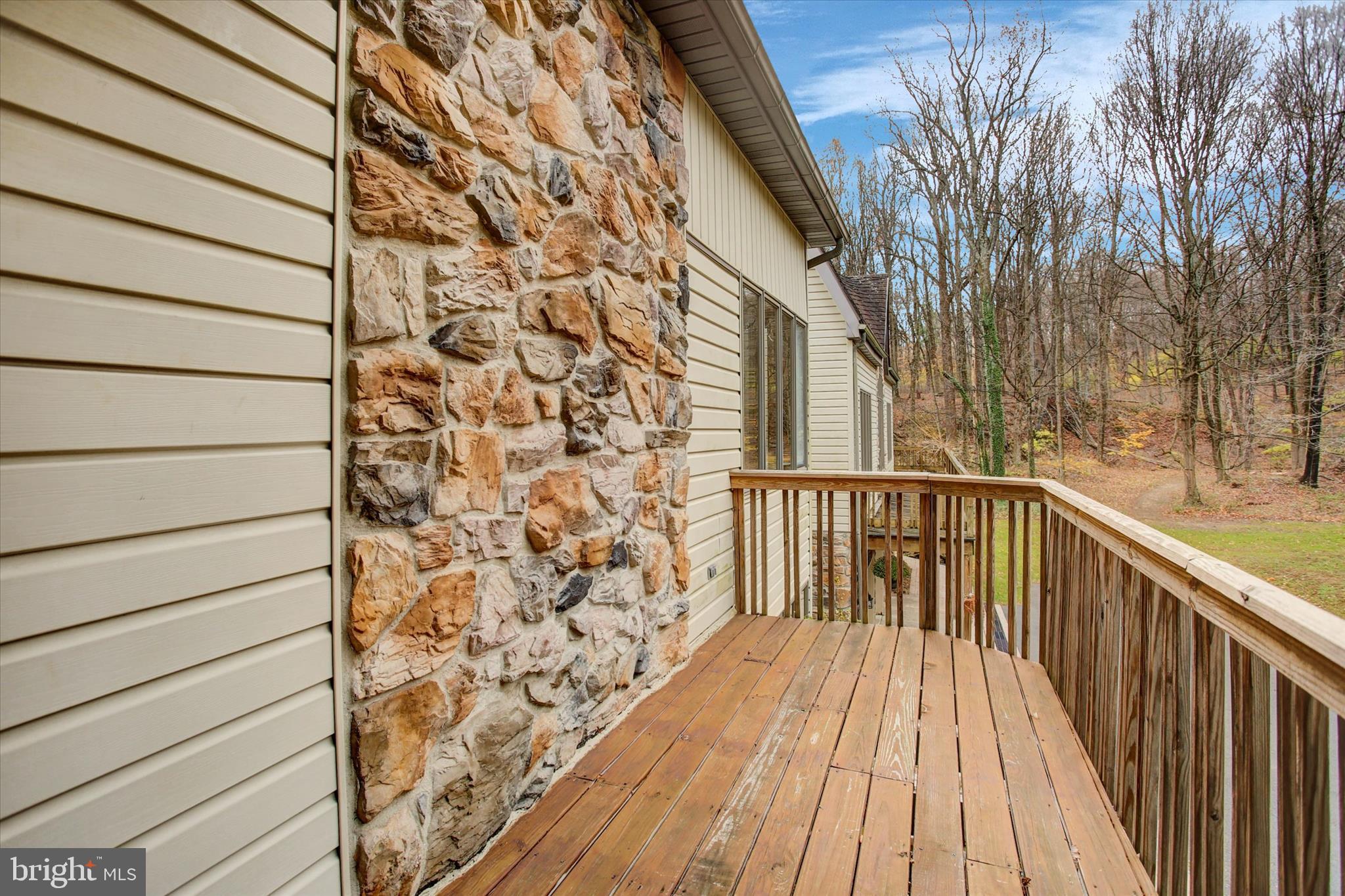9969 Circle Drive St. Thomas, PA 17252 - Photo 69 of 81 a balcony with wooden floor and trees