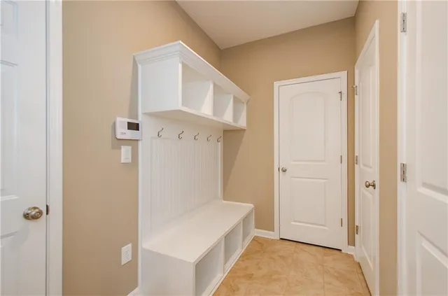 a bathroom with a granite countertop sink a toilet and bathtub