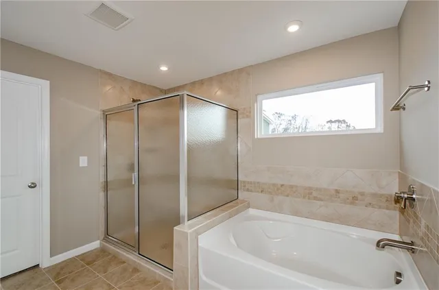 an aerial view of a swimming pool with a yard and outdoor seating