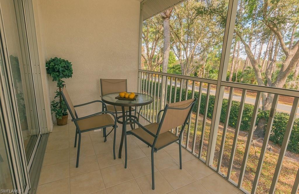 960 Partridge Circle, Unit 1202 Naples, FL 34104 - Photo 14 of 23 a view of a outdoor seating area