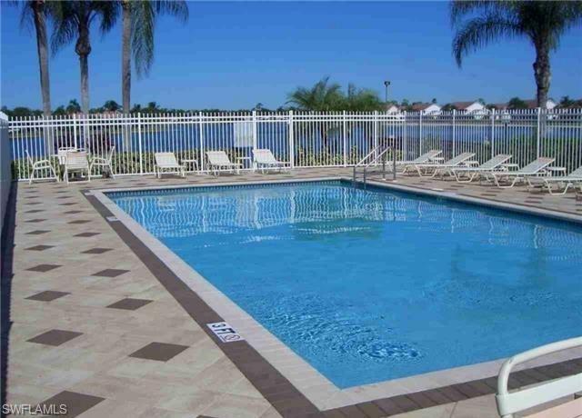 960 Partridge Circle, Unit 1202 Naples, FL 34104 - Photo 17 of 23 a view of a balcony with chairs