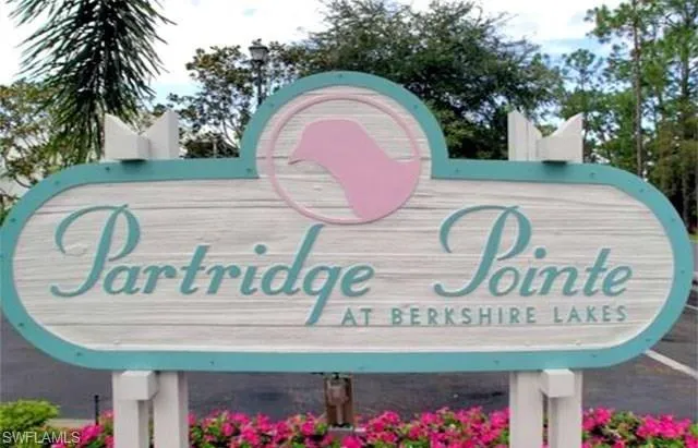 a sign that is on a brick wall