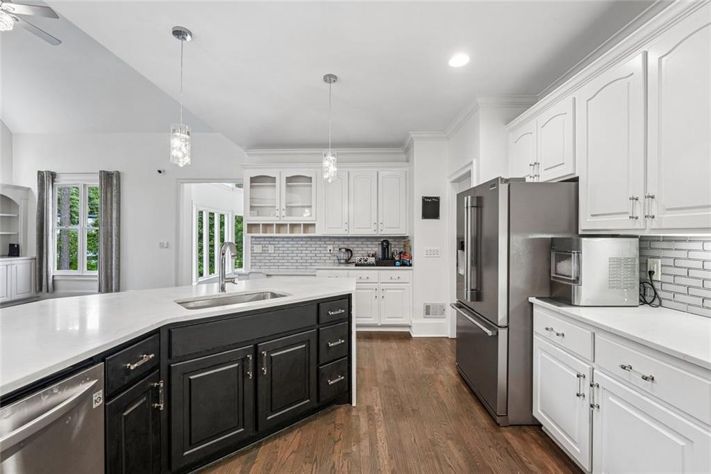1091 Fieldstone Trail Milton, GA 30004 - Photo 19 of 84 a kitchen with kitchen island granite countertop appliances cabinets and a sink