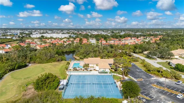 an aerial view of residential building and ocean view