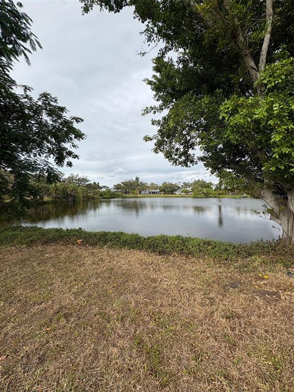 947 Shasta Road Venice, FL 34293 - Photo 13 of 52 a view of a lake with houses in the background