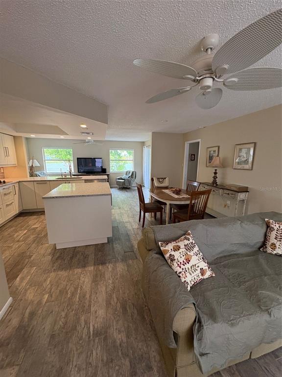947 Shasta Road Venice, FL 34293 - Photo 18 of 52 a living room with furniture and wooden floor