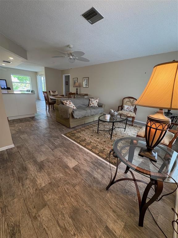947 Shasta Road Venice, FL 34293 - Photo 19 of 52 a living room with furniture and a flat screen tv