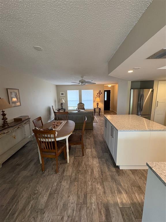 947 Shasta Road Venice, FL 34293 - Photo 29 of 52 a living room with furniture and a wooden floor