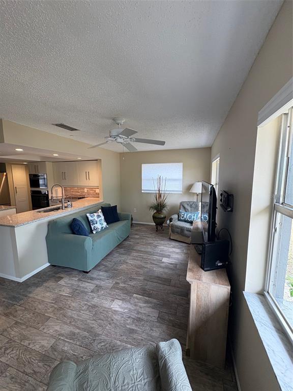 947 Shasta Road Venice, FL 34293 - Photo 32 of 52 a living room with furniture and a large window