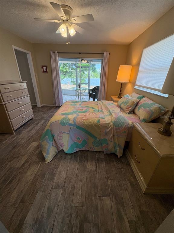 947 Shasta Road Venice, FL 34293 - Photo 50 of 52 a bedroom with a bed and wooden floor
