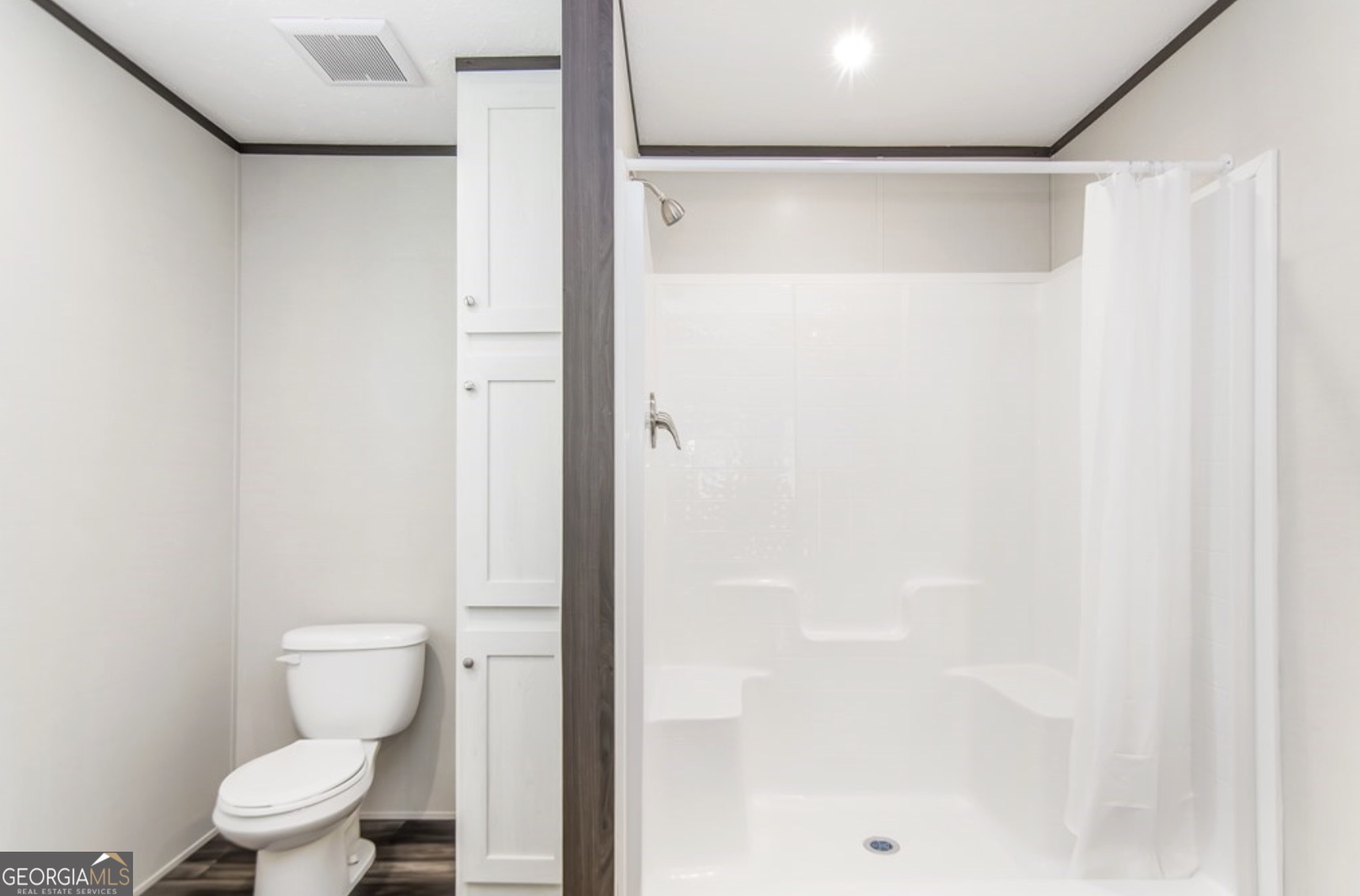 152 Wendy Hill Road Ellijay, GA 30536 - Photo 24 of 41 a white toilet sitting next to a shower