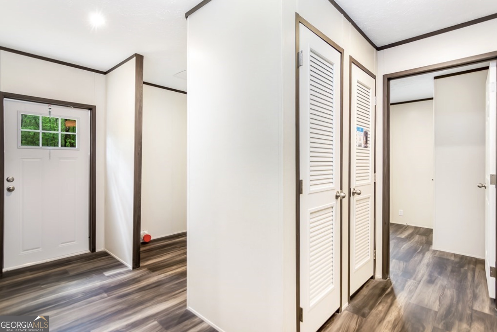 152 Wendy Hill Road Ellijay, GA 30536 - Photo 36 of 41 a view of a hallway with wooden floor and a bathroom