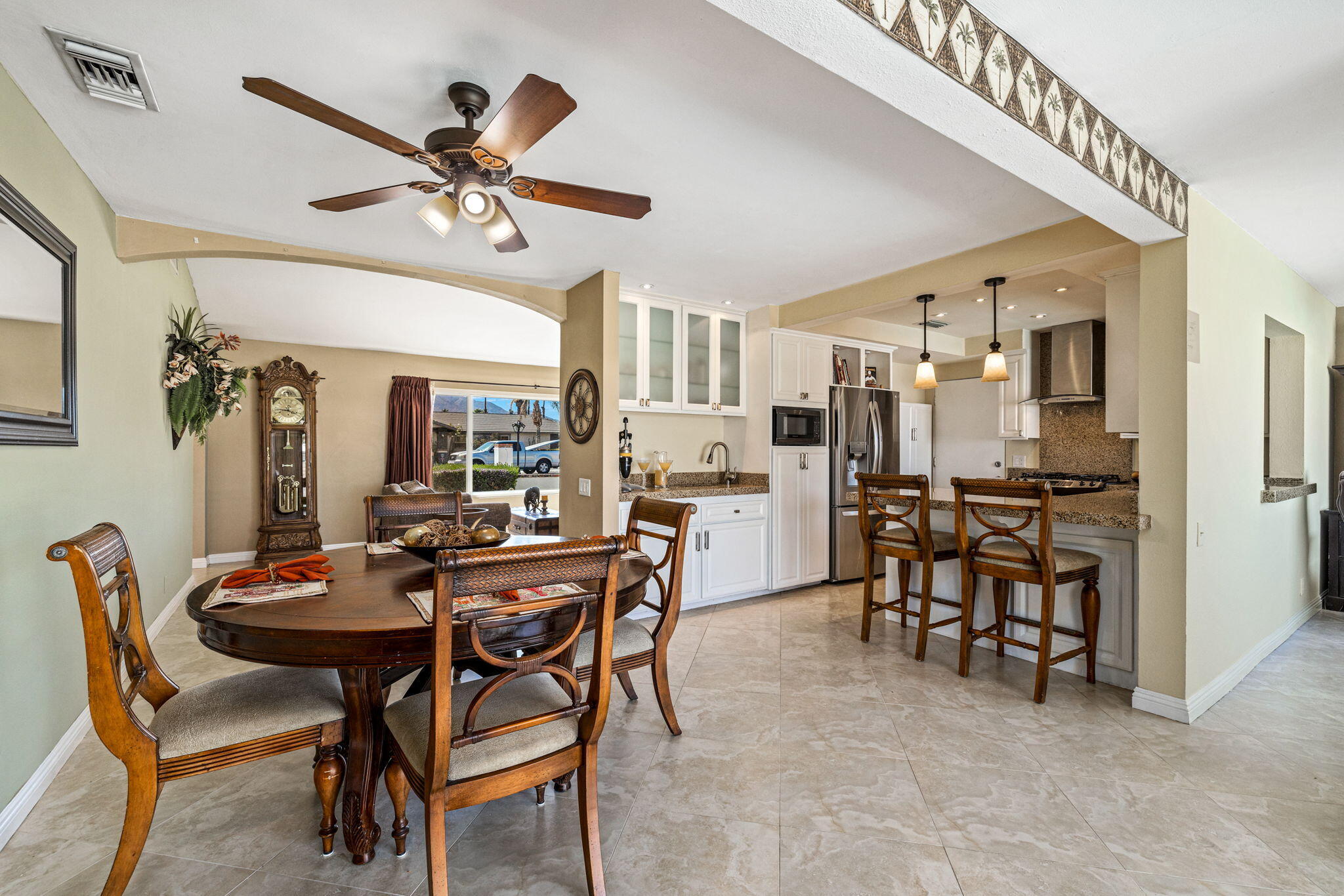 2290 North Victoria Road Palm Springs, CA 92262 - Photo 15 of 42 a view of a dining room with furniture and a chandelier