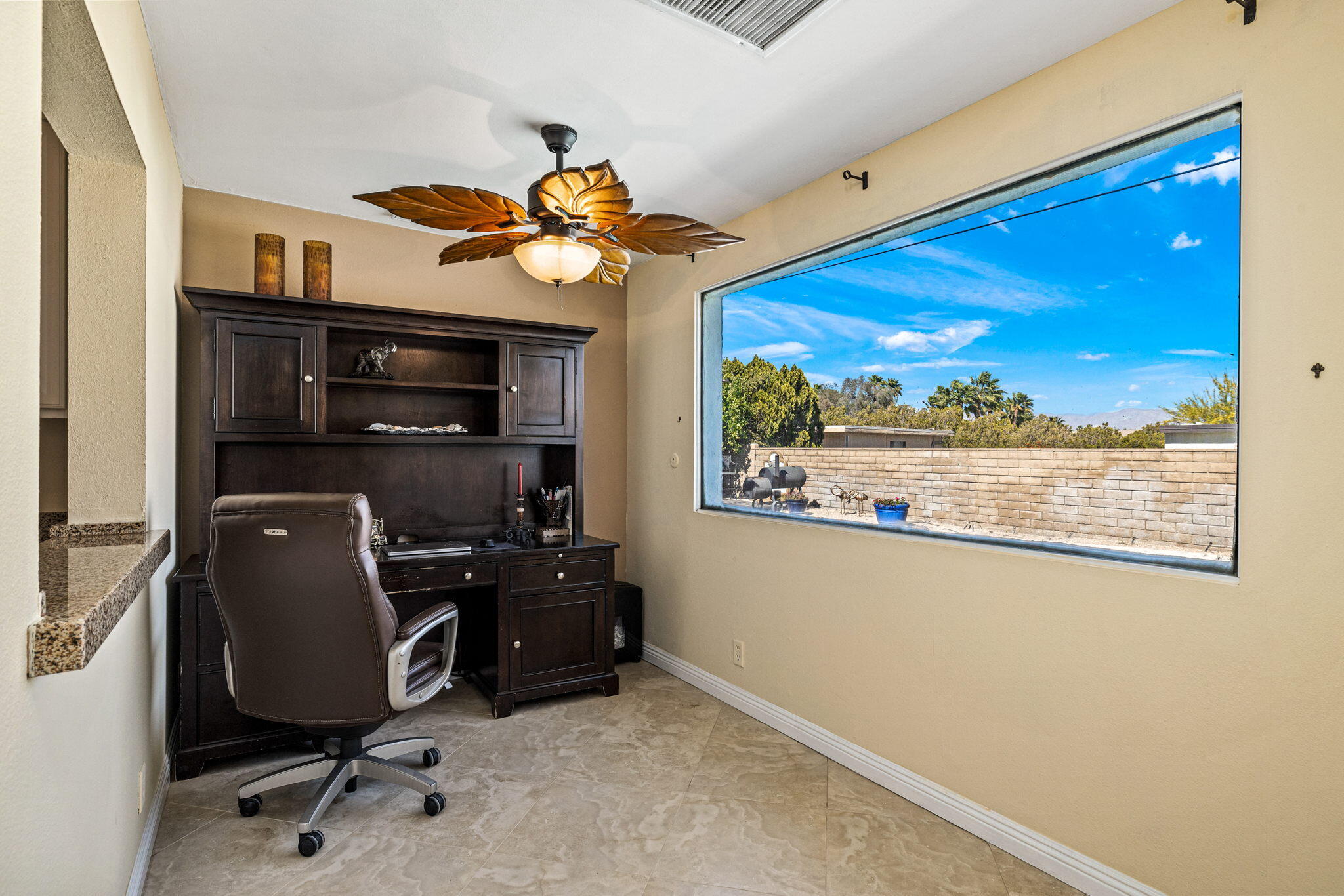 2290 North Victoria Road Palm Springs, CA 92262 - Photo 21 of 42 a view of a workspace with furniture and a window