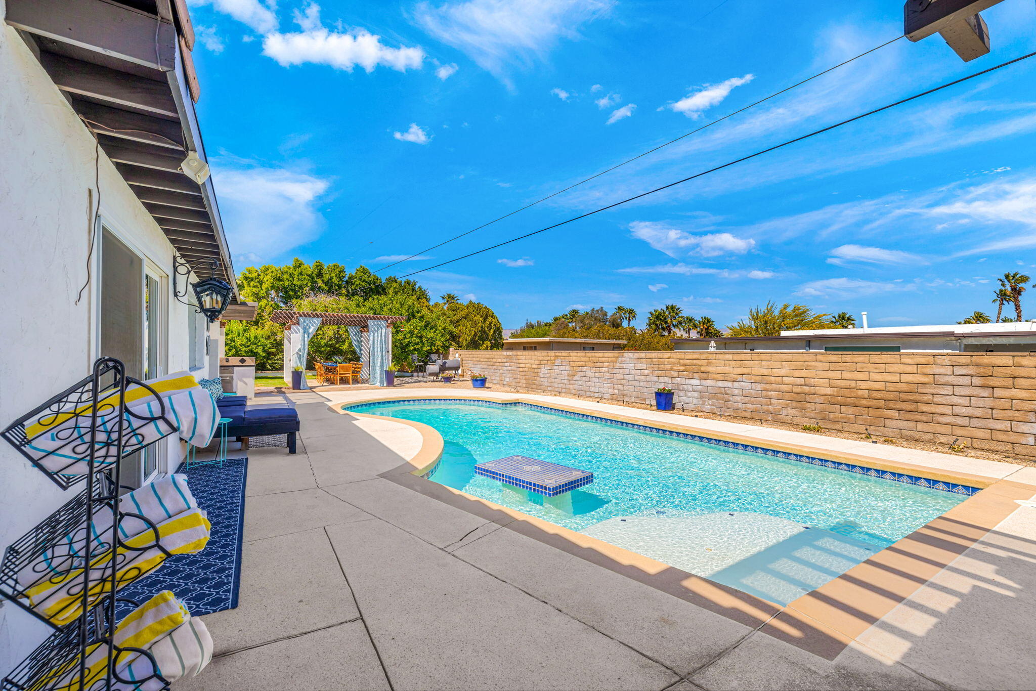 2290 North Victoria Road Palm Springs, CA 92262 - Photo 30 of 42 a view of a swimming pool with a lounge chairs