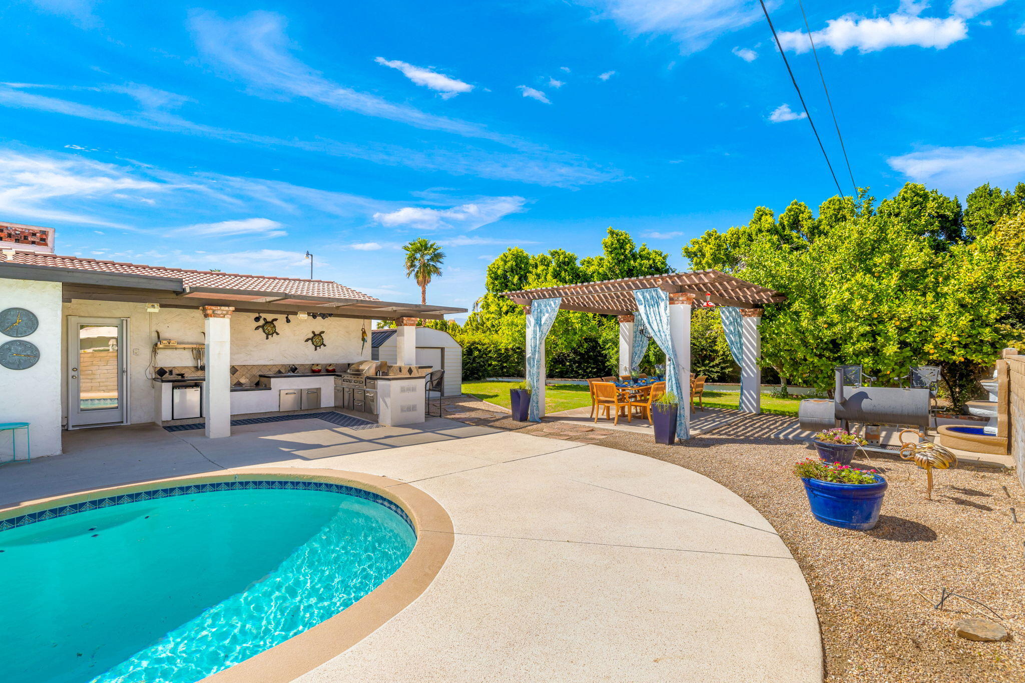 2290 North Victoria Road Palm Springs, CA 92262 - Photo 3 of 42 a view of a house with backyard porch and sitting area