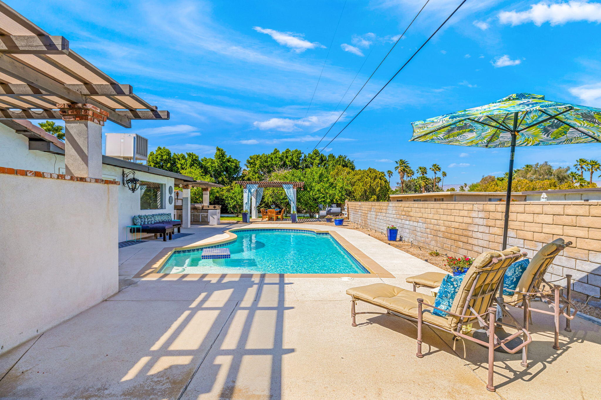 2290 North Victoria Road Palm Springs, CA 92262 - Photo 31 of 42 a view of a swimming pool with a patio