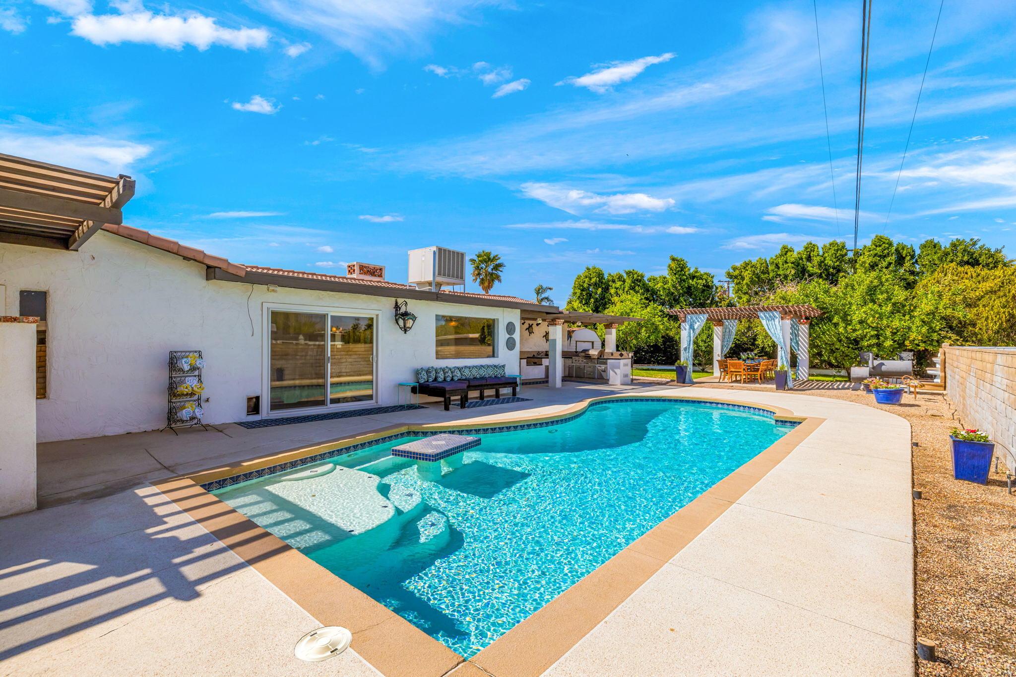 2290 North Victoria Road Palm Springs, CA 92262 - Photo 39 of 42 a view of a house with swimming pool and sitting area
