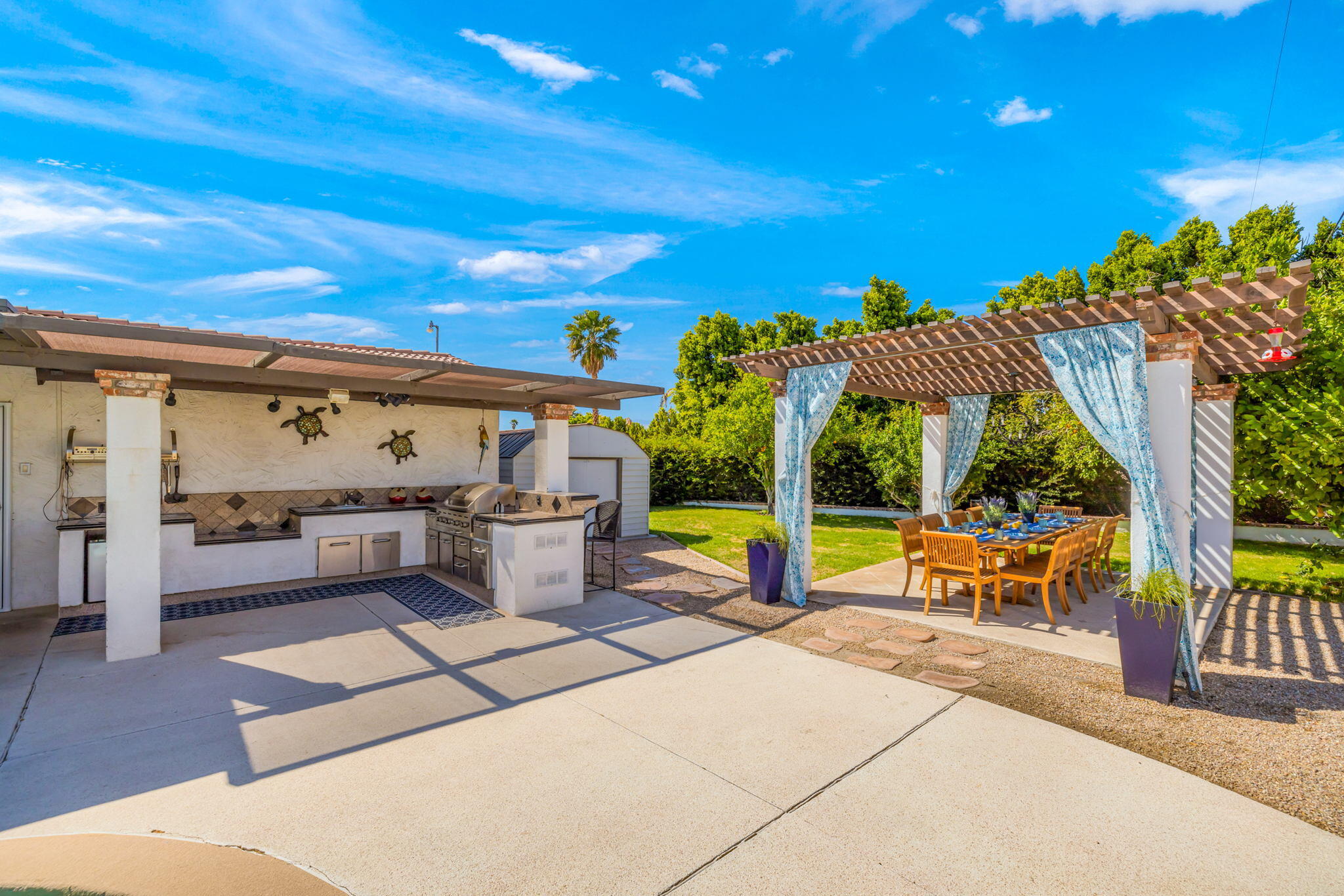 2290 North Victoria Road Palm Springs, CA 92262 - Photo 4 of 42 a view of a patio with swimming pool table and chairs