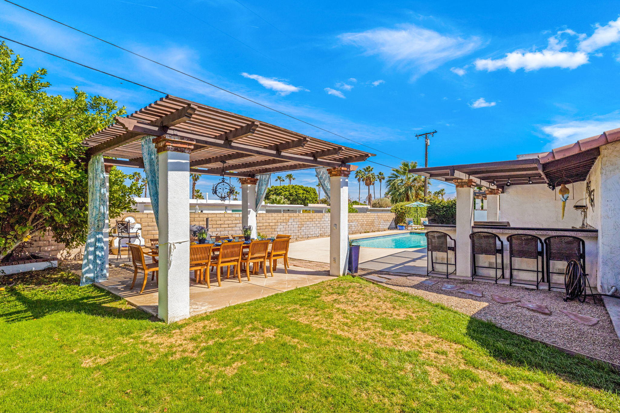 2290 North Victoria Road Palm Springs, CA 92262 - Photo 41 of 42 a view of a swimming pool with a patio
